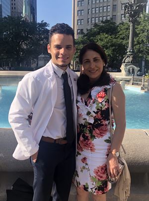 Christian Arce Guzman with his mom at white coat ceremony