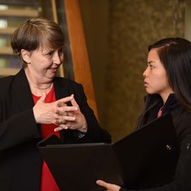 Regina Kreisle, MD, PhD talking with a student