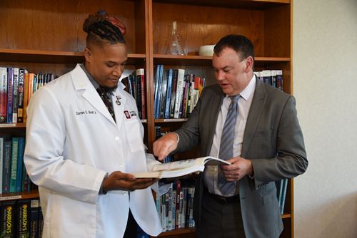 Derron Bishop with medical student Darren Bost Jr.