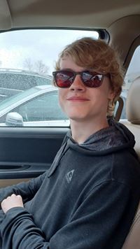 Evan Mowery, 16, wearing his new glasses