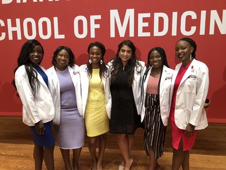Uche Emili with friends at her white coat ceremony