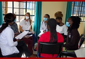 IU medical student Marissa Vander Missen discusses the training with others in Kenya.
