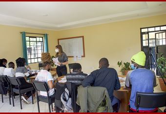 IU med student Marissa Vander MIssen leads a session with peer mentors in Kenya.