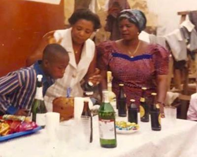 Michael Adjei with his mom and aunt in Ghana
