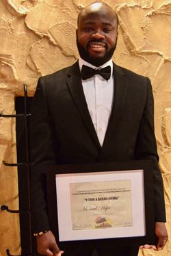 Michael Adjei with his I Have a Dream Award