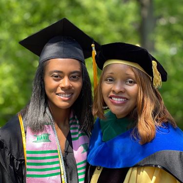 Lauren Turner at college graduation with her aunt, Dr. Crystal Watkins Johansson