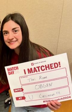Victoria Rone holds her Match Day sign.