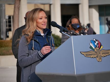 Lindsay Weaver at podium addressing media during the pandemic